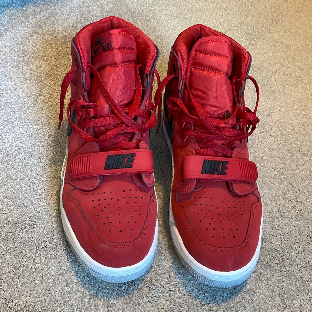 Red Suede Air Jordan Ones with black and patterned detailing